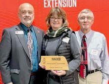Dean and Director of UNL Extension, Dr. Charlie Stoltenow, presents the NACEB Outstanding Volunteer Award to Tammy and Greg Gass.