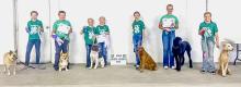 2024 Dog Show participants are pictured from L to R: Elise Brown, Henry Johnson, Kimber Burge, Marlie Burge, Chloe Christiansen, Adalin Wickman, and Sarah Burge.