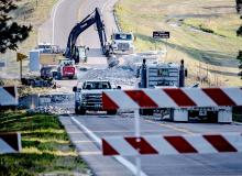 The Minnechuduza Bridge on Highway 12 has been removed. Here you can see equipment breaking up the concrete. Photo by Laura Vroman