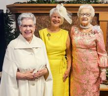 Dressed for tea were Jeanene Roth, Cindy Monroe, and Amelia Monroe.