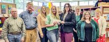 Pictured at the check presentation are from L to R: Sandhills Area Foundation Board members Monty Neiffer, Gregg Perrett, Talia Benson and Morgan Arnold, Valentine Public Library Director Carrie Graham, library staff members Janel Schubauer and Nichole Garwood, and SAF Executive Director Carolyn Moore.