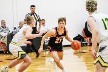Crawford junior Taylor Homan on the drive during subdistrict basketball action versus Hay Springs. The Hawks defeated the Rams 62-37. Homan would surpass 1,000 career points, but his efforts were not enough to stop the Hawks, as Hay Springs would go on to win 64-60. Photo by Zoey Dorian