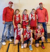 Pictured are the Mini Badgers from L to R: Coach Al Daugherty, Orion Markley, Kade Arganbright, Evan Moosman, Coach Kurt Arganbright. Front row, L to R: Blake O’Kief, Spencer Beebout, Duke Daugherty. Photo by Anna O’Kief