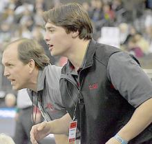 Pictured above are Head Coach Shane Allison, and Gage Krolikowski cheering on the Badgers. Photos by DeanNa Fowler