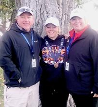 Coach Muirhead, Tierney Miller who placed 12th individually, and Coach Houdek.