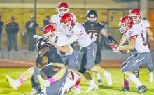 The Badgers get after Chase County’s ball carrier.