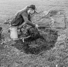Nebraska Forest Service Professional Tree and Landscape Community Forester Chrissy Land is seen planting a honey locust in the Valentine City Park.