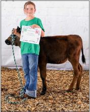 Ava Rahn, Champion Bucket Calf. Photos by Jennie Nollette