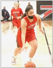Malika Monroe dribbling down the court in the game against Broken Bow. Photo by Mary Reagle