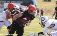 CK junior, Hesston Fay meets a Stuart defender during action against the Broncos at Cody Athletic Park. Stuart won 46-20. Photo by Shontell Roseberry