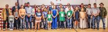 4-Hers and veterans gather together after the Quilts of Valor were presented.