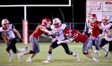 The Badgers are going for the Cardinal’s ball carrier in the game held at home, Friday, September 16, 2022. Photos by DeanNa Fowler
