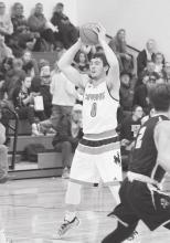 Gage Davis #0 is looking for a teammate to pass the ball to. Photo by Shontell Roseberry