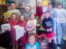 Simeon School chose the pet shelter and Cherry Hills for their service projects this year. Students made cards for each resident at Cherry Hills to brighten their holidays. Close to 200 pounds of cat and dog food, as well as some treats, toys, and bedding were collected and will be donated to help the animals at the shelter.