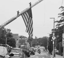Procession through Brighton, NE and salute from firefighters.