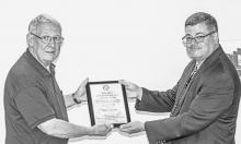 Photos by Laura Vroman Above, John Wilson receives the Wright Brothers flying award from FAASTeam Program Manager Mark Gaffney.