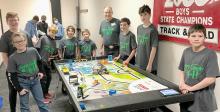 The Badger Bots Robotics team warms up for competition! From L to R: Cole Boes, Isaac Utecht, Tyler Harp, Kaden Garwood, Tilden Foster, Coach Andrew Utecht, Allen Ward, Duncan Mosner, Jhett Jespersen. Team members Kross Kasner and Dawson Fleagle not pictured as they were unable to attend the Regional competition after the date was postponed due to Covid concerns.