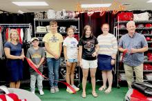 Pictured at The Badger Den Ribbon Cutting are from L to R: Kris Larsen, Future FBLA Member and current Badger Den customer Tate Ward, Landen Mooney, Caitlyn Mack, Jessa Klabenes, Alana Cardinal, and Dean Jacobs.