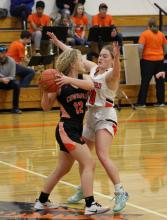 Colby Cady moves the ball away from her defender in the game against Crawford. Photo by Shontell Roseberry