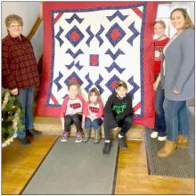 Julie Foster was the winner of the Quilt of Valor raffle. The quilt was created by 4-H members Ruby Shelbourn, Cadence Swanson, Kate Cox, and Rylee Wackler with the help of Leader, Rhonda Cherry.
