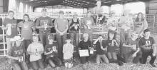 Youth were able to judge six classes after spending time with Dr. Doug Smith. Here are the 4-H participants holding ribbons and certificates from the competition.