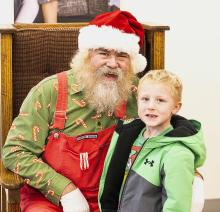Oscar Daugherty stopped by to visit Santa, and didn’t have a list at all, but will share one later this season. More photos on page 11. Photos by Laura Vroman