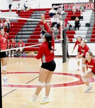 Olena Felton #12 spiking on the outside in the game against Ainsworth.