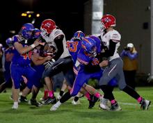Seniors Thane Taylor #72 and Quinton Nelson #75 blocking the Mustangs.