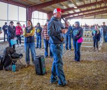 Gathering under the Pavillion at the Cherry County Fairgrounds, VCS teacher Mr. Brent Nollette addresses the students. To his left is Michelle Garwood current alumni president, and Jill Austin past alumni president Valentine hosted more than 350 students from 20 schools for the District 9 Fall CDE. Photos by Tina Boone