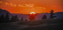 A blazing orange sky from a year ago at Fort Robinson, will now have a different landscape after the South Fork Fire. Photo by Laura Vroman