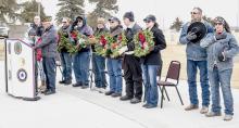 Pictured are from L to R: Pastor Tim Wilkinson, Little Miss Poppy Darby Murphy, Little Miss Poppy-in-Waiting Maggie Arnold, Rex Gallino, Michael Gallino, Bill Potter, Dick Allard, Ron Brown, Sam Spain, Kelly Keough, Rick VanderWey and Kitty VanderWey, who are reciting the Pledge of Allegiance. Photo by Laura Vroman