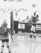 Kassidy Roseberry #3 hitting the ball in Homecoming play.