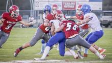 Grant Boes #56 and Traven Fletcher #88 work to take down Gordon-Rushville’s ball carrier, in the Homecoming game held Friday, September 30, 2022. Photos by DeanNa Fowler