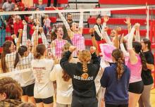 The entire Lady Badger team celebrates victories after their triangular. Photos by Nina Maria Nelson