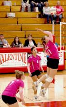 Annalena Nelson #11 prepares to return the ball in the Lady Badgers triangular held Tuesday, October , 2024. Photos by Nina Maria Nelson