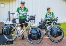 Jayson Goetz and Mary Montigny in front of the White Elephant Hall in Cody, NE. Photo by Tina Boone