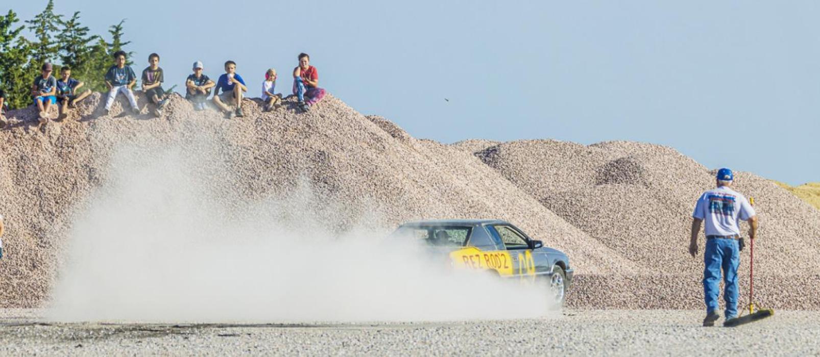 After the cruise, those who paid an entry fee competed in the third annual Burn Out Contest behind SpeedeeMart.