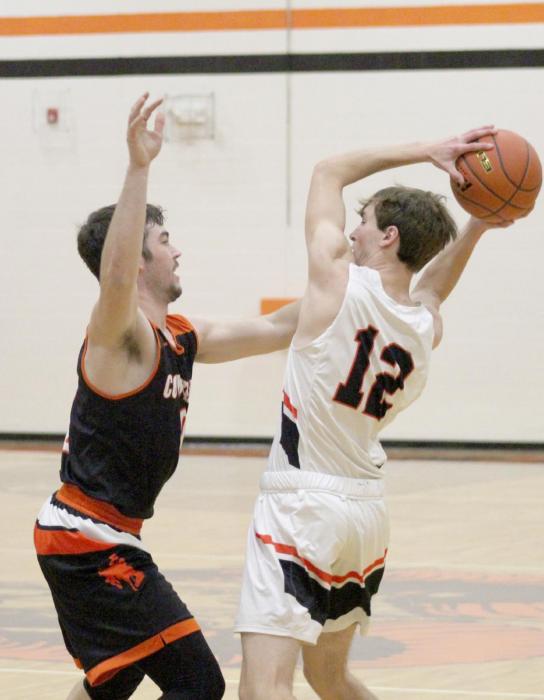Gage Davis #0 does his best to block his opponent in the game against Crawford. Photo by Shontell Roseberry