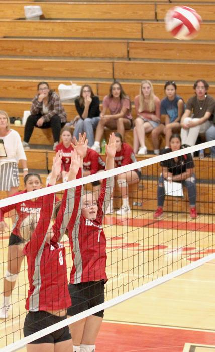 Blocking the net are Taycee Reimers and Aubrey Benson in the game against Bennett County. Photo by Amanda Long