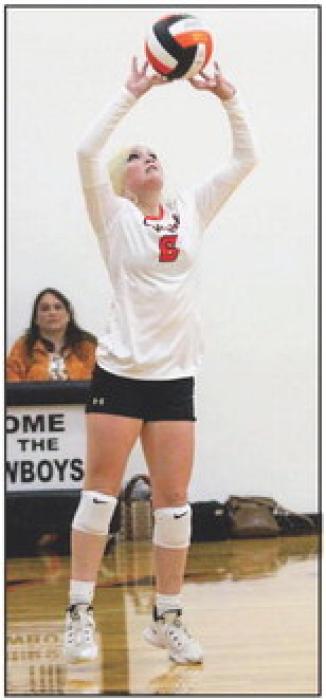 Maddie Leithead setting the ball against the Minatare Indians, Friday, September 22, 2023. Stats were not available at press time. The Cowgirls will travel to Crawford, Friday, September 29, 2023.