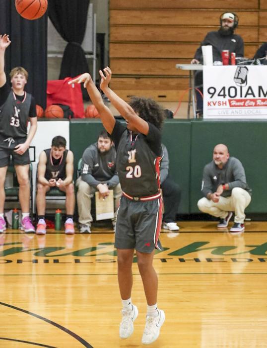 Jackson Huggins #20 shooting a 3 pointer.
