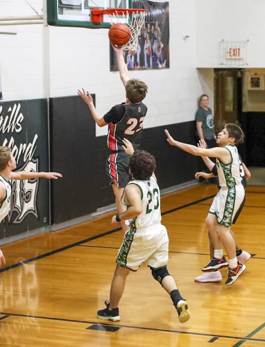 Colin Bailey #23 lay up for 2. Photos by Nina Maria Nelson