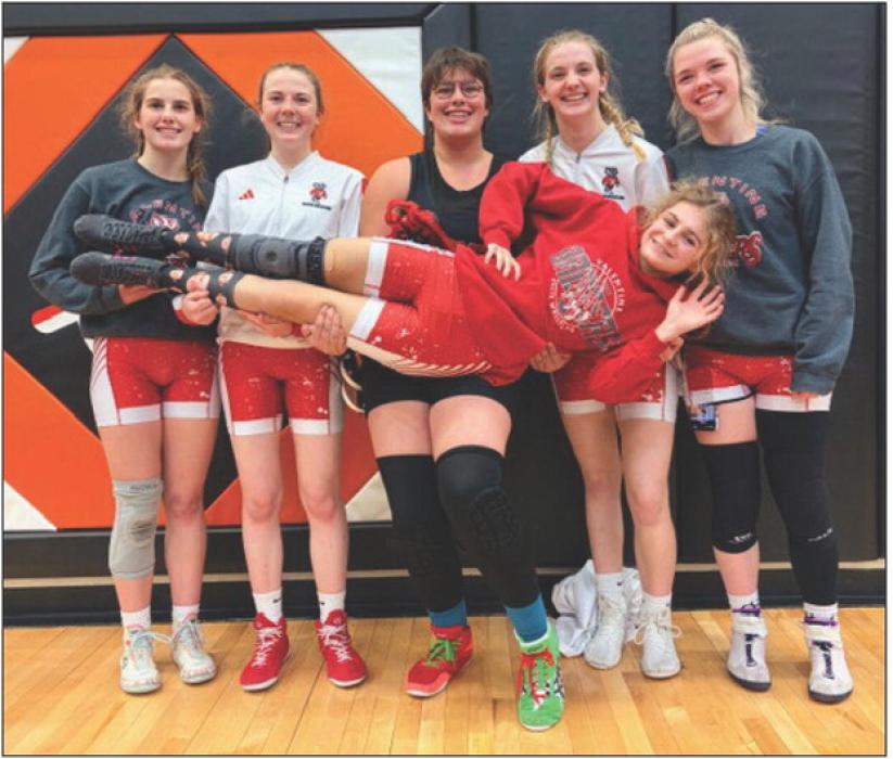 The Lady Badger Wrestling team at VHS has the following NSAA State qualifiers. They’re pictured from L to R: Danika Janssen, Bailey Burdick, Addie Sexson, Samantha Sprenger, Haddison Mundorf holding Reegan Eggert. Photo by Lorana Eggert