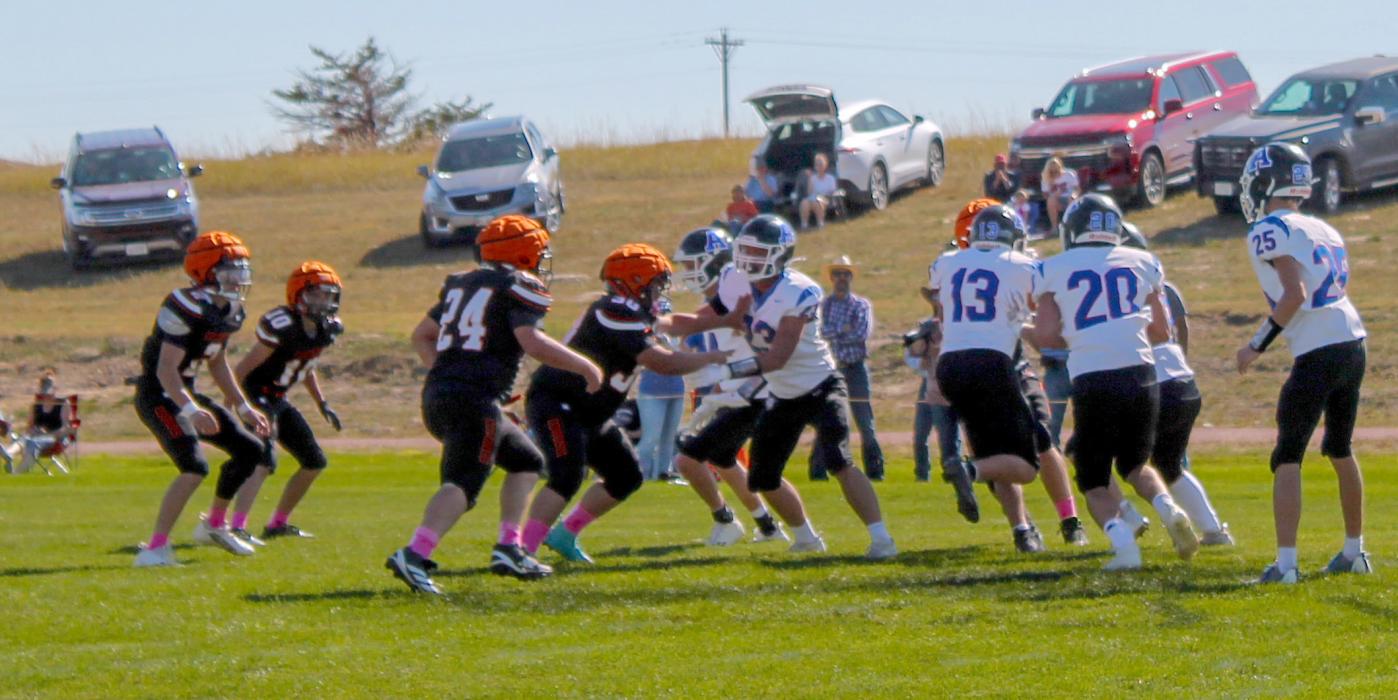 The Arthur County Wolves set up a sweep against the Cowboys defense led by CK junior Wesley Willert #24, freshman Coyoke Sterkel #30, Kaden McNare #2, and Knox Wobig #1, in football action in Cody, NE. Photos by CK senior Kynzee McConaughey