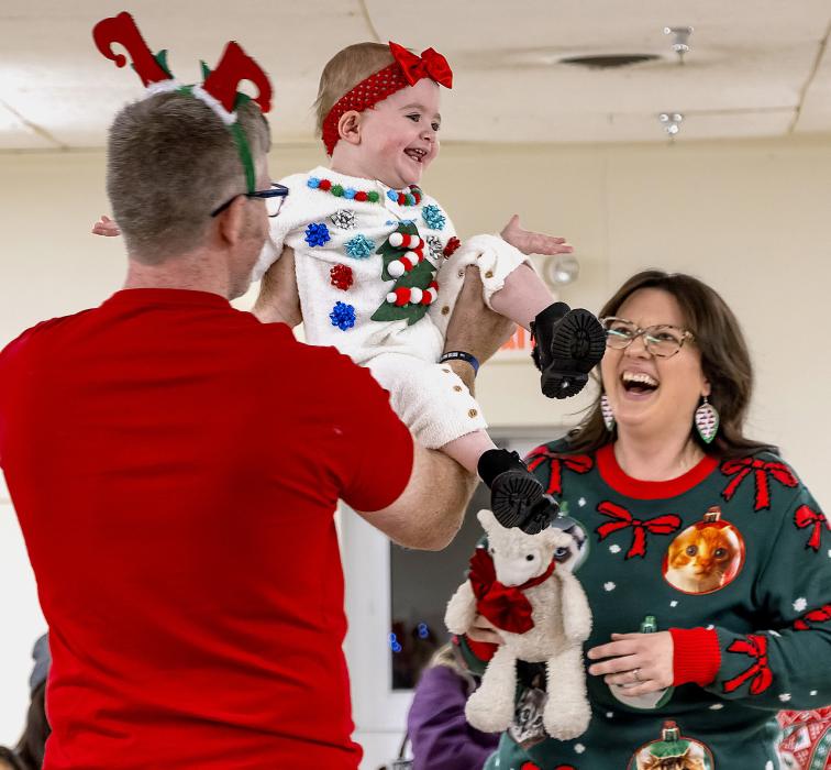 All smiles, the Rhea Family earned first place in the Ugly Sweater contest family division.