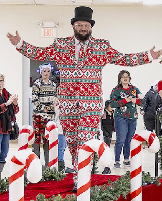 Rich Frantz, who earned second place, shows off his Christmas spirit in the Ugly Sweater contest sponsored by State Farm.