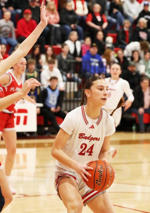 Mia Sherbeyn #24 looking for a pass.