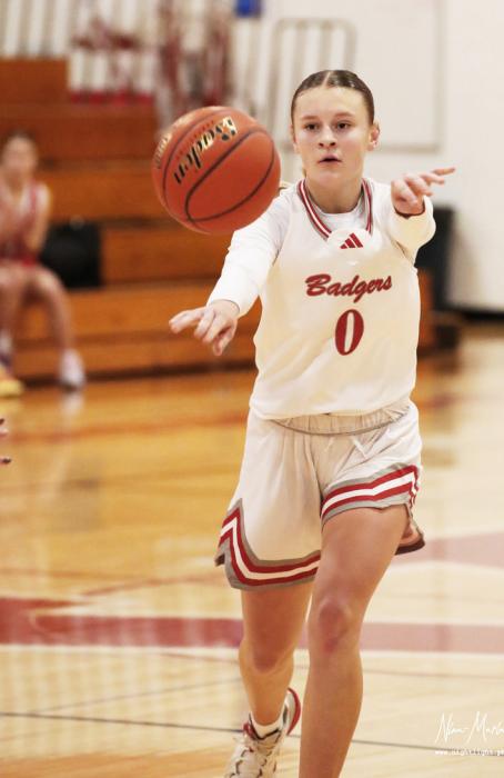 Joni Cox #0 passing the ball. Photos by Nina Maria Nelson