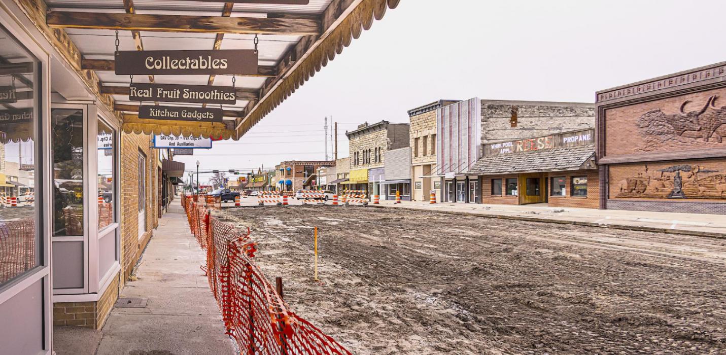 Facing south in front of Janine’s Emporium, a fence has been erected that will separate the sidewalk from the dirt work that will be on going throughout the spring months. All businesses on Main Street will be accessible with minor exceptions when the road and sidewalk construction begins.