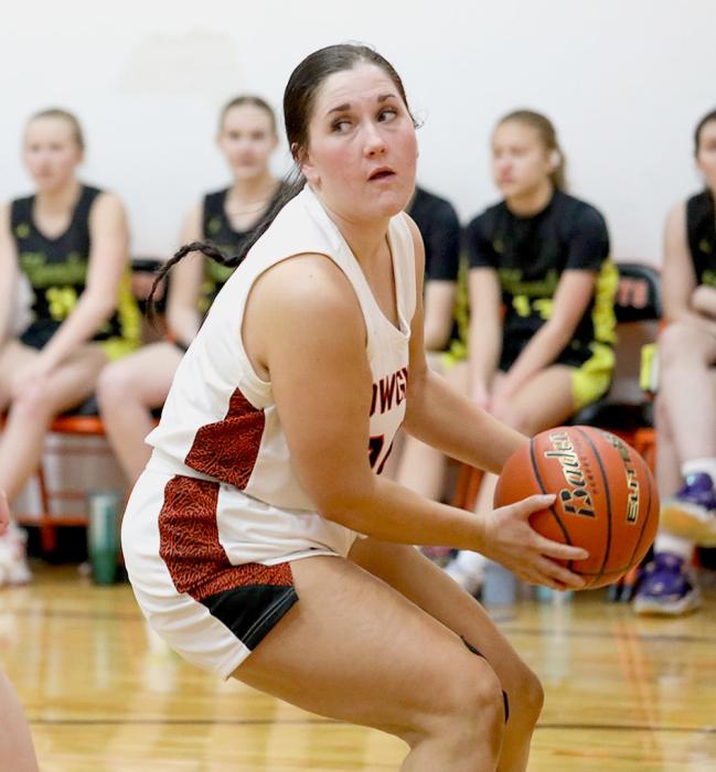 Sadee Adamson #24 gets the rebound and looks for an outlet.
